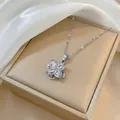 Detail of a rotating flower pendant with marquise-cut cubic zirconia on a silver chain - Rotating Flower Pendant Necklace / Silver (X0059)