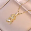 Sparkling crown bear necklace with heart zircon and gold chain on beige jewelry tray - White Heart Style / Gold White Heart Bear