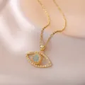 Elegant gold Evil Eye necklace featuring blue beads and white zircon stones on silk - Evil Eye Necklace (X2682)