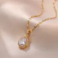 Elegant gold-plated necklace featuring a large pear-cut zircon pendant on silk background - Gold Waterdrop Necklace