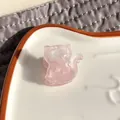 Detail of pink cat acetate hair claw clip showing glossy resin texture and teeth - Light Pink