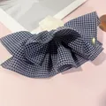 Plaid navy and white cotton scrunchie with layers of ruffles and golden metal tag - Ruffled Spring Clip