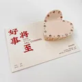 Pince à cheveux cœur rose clair avec strass bruns sur une carte cadeau décorative - Strass / 6.5cm / Beige