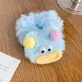 Chouchou en peluche bleue avec personnage de dessin animé aux grands yeux et pompons - Tête de monstre bleu