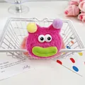 Chouchou monstre en peluche rose vif avec de grands yeux et des lèvres vertes - Tête de Poupée Rose Rouge