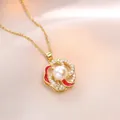 Elegant gold necklace featuring a rotating flower pendant with pearl and red enamel inlay - Gold
