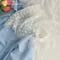 Elegant white lace floral triangle bandana with delicate embroidery and bow design - White