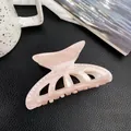 Light pink marble textured hair claw clip with white pearls on black leather background - Peach Pink (8.5cm)
