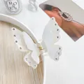 Translucent white butterfly hair claw with sparkling rhinestones and golden metal spring - Mermaid White