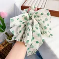 White chiffon floral scrunchie with green polka dots and gold embroidery on hand - Green Bow