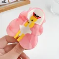 Detailed macro view of a pink marble acetate hair claw clip featuring a cartoon character - Pink Gorilla