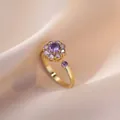 Bague fleur dorée ajustable avec zircons violets sertis et design rotatif élégant - Bague Rotative Violette (J0002)