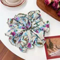 Elegant floral pattern scrunchie in beige fabric with pink flowers and green edges - Purple