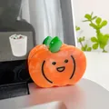 Detail showing high-quality acetate pumpkin hair claw clip with cute smiling face design - Pumpkin