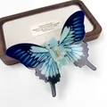 Elegante pinza per capelli a farfalla in acrilico blu sfumato con molla dorata per donne - Farfalla Drago Blu