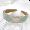 Checkered fabric headband in green, pink, and purple plaid with thick padded design - Green