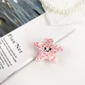 Pinza per capelli a forma di stella marina in acetato rosa a pois con faccina felice - Stella Marina