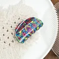 Semi-circular hair claw clip featuring a vibrant colorful geometric ethnic print - Diamond Red