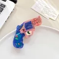Whimsical pistol-shaped hair claw clip in blue and pink acetate with floral print - Handgun