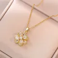 Elegant gold spinning flower pendant necklace with white zircon petals in a jewelry box - Refined Rotating Flower Necklace (X1081)