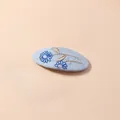 Detailed embroidery of daisies and leaves on a light blue fabric BB hair clip - Milky Blue