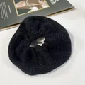 Elegant black knit scrunchie with soft fur texture and elastic hair tie design - Black