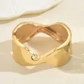 Close-up of gold-plated wide cuff bracelet with modern irregular wavy texture design - Gold Style (SL7986)