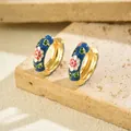 Detailed close-up of gold-plated hoop earrings with blue enamel and floral patterns - Hoop Huggie (1 Pair) / Gold Base Deep Blue Enamel Floral (EH5456)