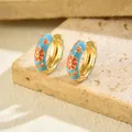 Detail of light blue and orange enamel floral huggie hoop earrings on stone - Gold Base Blue Orange Enamel Petal (EH5456-5)