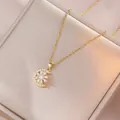 Elegant gold celestial necklace featuring a crescent moon and sun pendant with zircon - Rotating Flower Necklace (X0482) / Gold