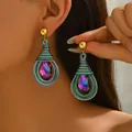Macro detail of bohemian teardrop earrings with woven thread and purple gemstone - Bohemian Braided Purple Gemstone Earrings (EH5228)