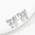 Macro detail of silver ribbon earrings with textured metallic pleats on marble surface - Silver Pleated Ribbon (BSSP005B)