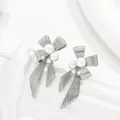 Elegant silver bow earrings with geometric pearl inlay on minimalist display - Silver Bow Pearl Tassel (BSSP004B)