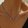 Gothic silver thorn heart necklace with red gemstone and diamonds on a female neck - Red Heart Style (XL5442)