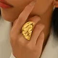 Modern gold-plated ring with geometric pleated design shown on model's hand - Modern Minimalist Hammered Texture Style (JZ1312)