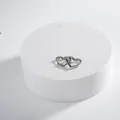Elegant silver heart-shaped huggie earrings with a polished hollow metal design - Silver Small
