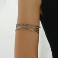 Close-up of gunmetal layered arm cuff with hammered texture on female upper arm - Hammered Gun Black Style (SL7435-3)