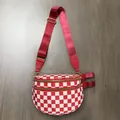 Detail view of red checkered nylon crossbody bag with dual golden zippers and strap - Red Plaid