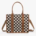 Detail of checkered tote bag featuring brown leather trim and detachable shoulder strap - Large Plaid Brown