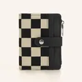 Detail of the checkered canvas and black leather texture on the small folded wallet - Checkerboard Patchwork Style / Black Lattice