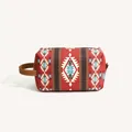 Close-up of red Bohemian PU leather toiletry bag with tribal geometric patterns - Red