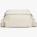 Close-up of cream beige crossbody bag featuring golden hardware and dual zipper texture - Beige
