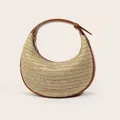 Detail of hand-woven crescent bag featuring brown leather trim and metal zipper closure - Brown