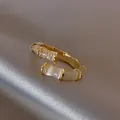Gold bamboo-shaped ring featuring elegant white cat's eye stone and pavé zircon details - Bamboo Ring (Z0060) / Gold