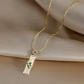 Golden box chain necklace with jade-style bamboo pendant and zircon leaf accents - Bamboo Necklace (L0008) / Gold