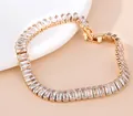 Elegante bracciale tennis placcato oro con zirconi a baguette e chiusura a scatto - Stile Zirconia Trasparente Baguette / Oro