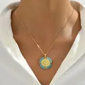 Minimalist gold necklace with a blue beaded religious medallion shown on a model - Sky Blue Beads (XL5349)