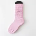 Solid pink slouch socks with ribbed texture for a comfortable vertical stack look - One Size / Pink