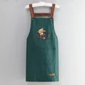 Waterproof dark green apron featuring a cartoon bear print and brown cross-back straps - NICE Bear Green (Thickened Style)
