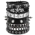 Close-up of gothic punk bracelets featuring silver skulls, star charms and metal spikes - Skull Star Multi-Layer Set (05)